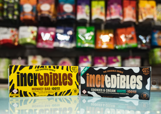 Assorted cannabis edibles and products on dispensary shelves